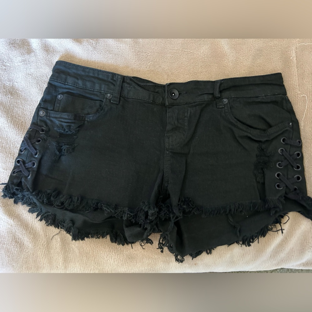 Billabong Lite Hearted Lace Up Leg Black Denim Cut Off Shorts. Women’s size 28